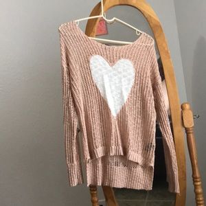 pink sweater with white heart